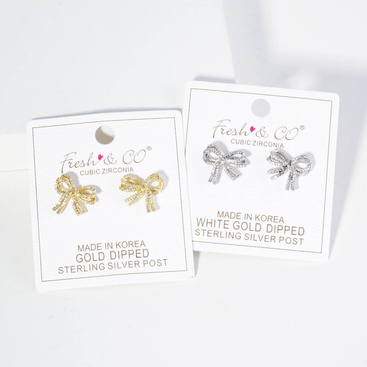 Micro Pave Set Cubic Zirconia Ribbon Bow Stud Earrings