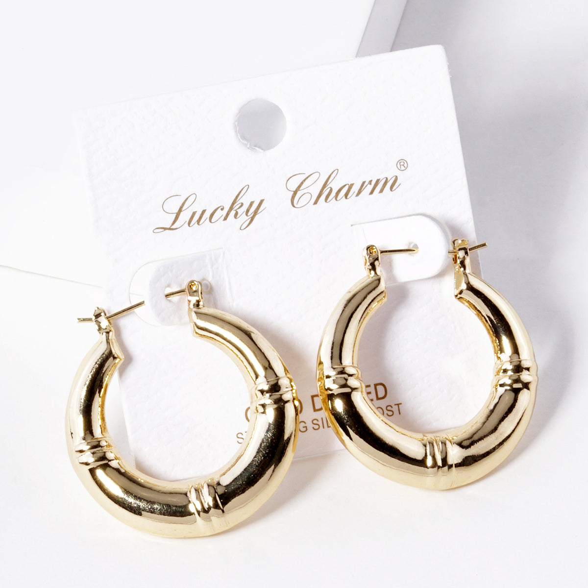 BE365 gold-tone hoop earrings on display card