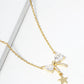 White Gold Dipped CZ Pave Ribbon Bow With Star Drop Pendant Necklace