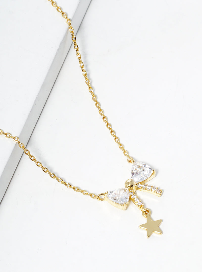 White Gold Dipped CZ Pave Ribbon Bow With Star Drop Pendant Necklace