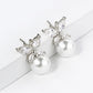 18K Gold Dipped Cubic Zirconia Butterfly Sitting On 8mm Pearl Stud Earrings