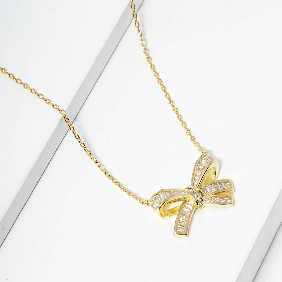 Elegant Pavé Crystal Bow Pendant Necklace