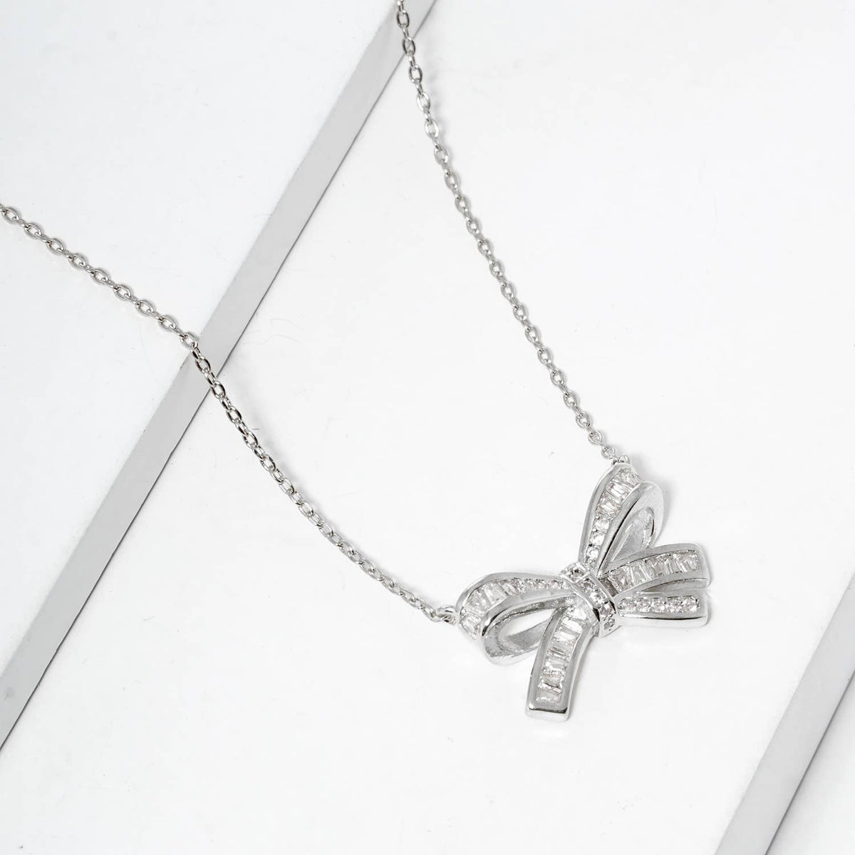 Elegant Pavé Crystal Bow Pendant Necklace