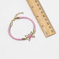 Pink Ribbon Butterfly Bracelet – Gold-Dipped Braided Charm
