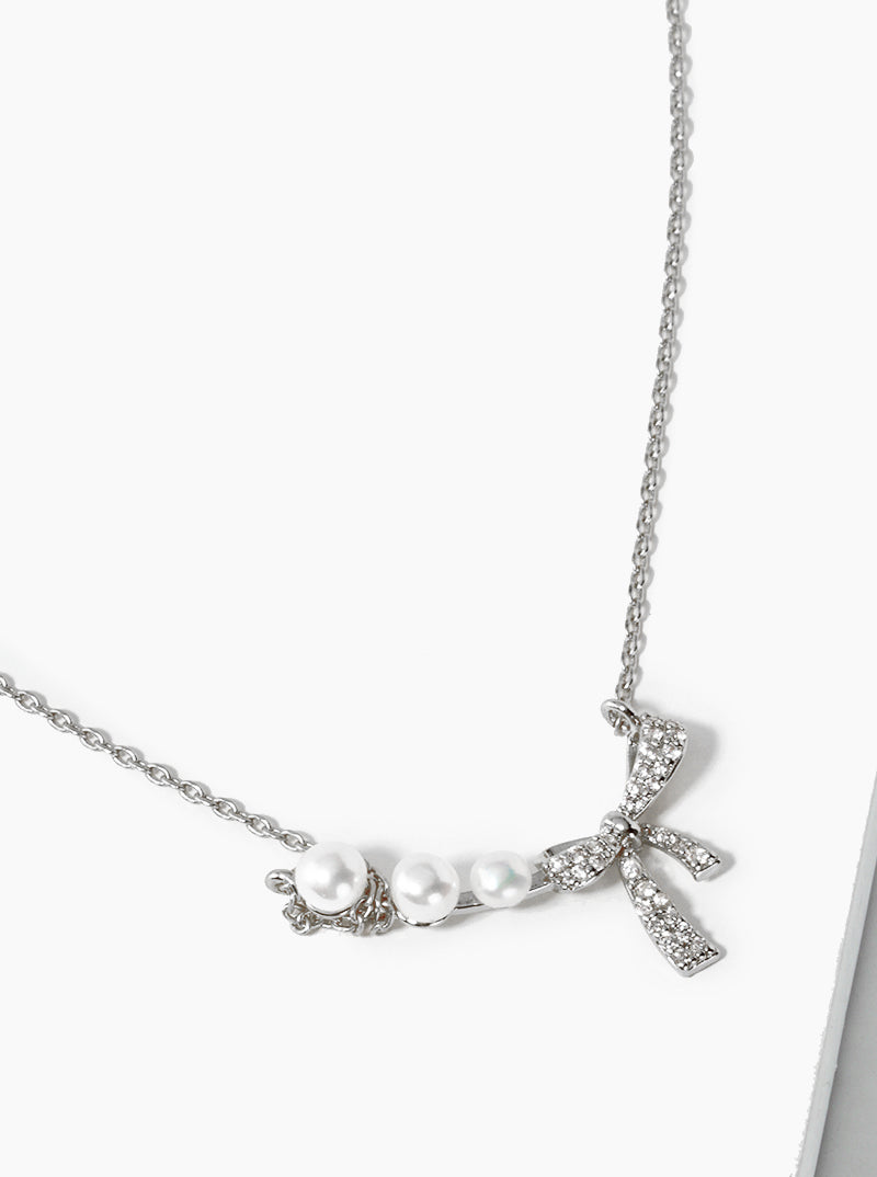 White Gold Dipped CZ Pave Ribbon Bow Pearl Pendant Necklace