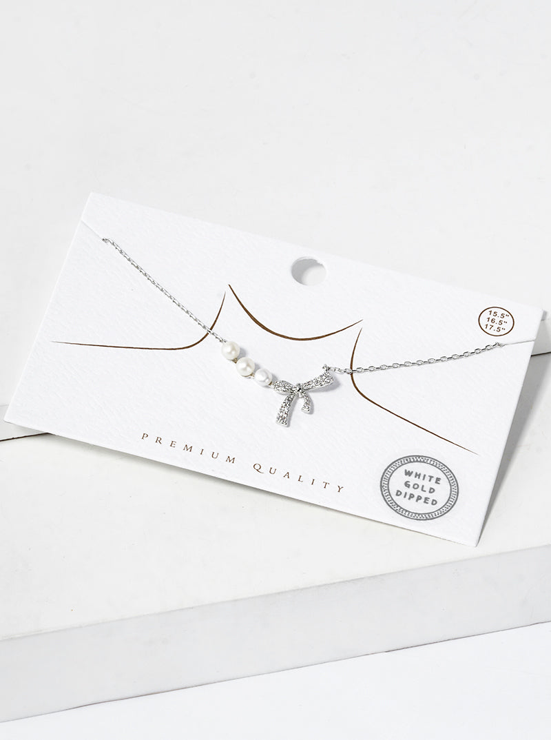 White Gold Dipped CZ Pave Ribbon Bow Pearl Pendant Necklace