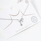 White Gold Dipped CZ Pave Ribbon Bow With Star Drop Pendant Necklace