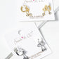White Gold Dipped CZ Ribbon Bow Drop 8mm Huggie Hoop Earrings
